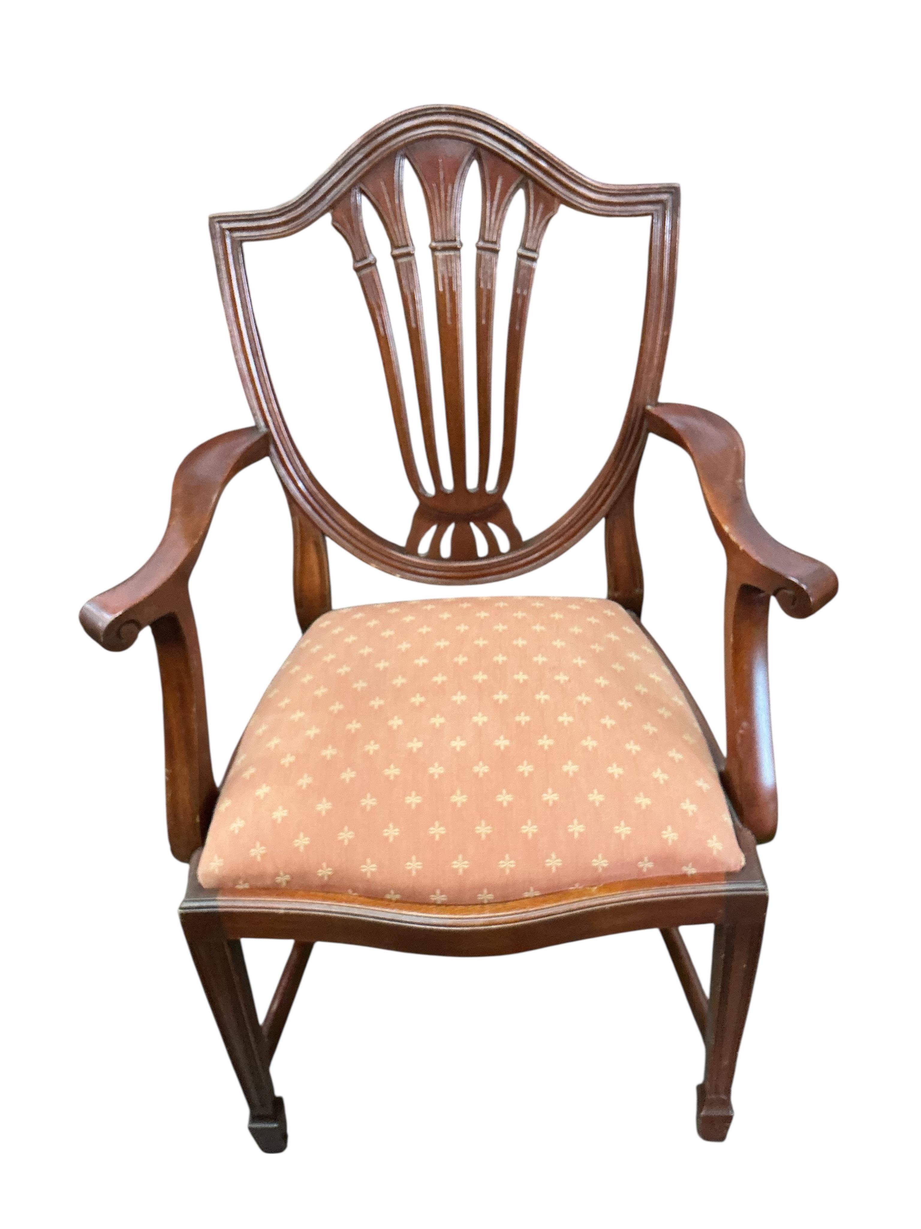 A reproduction mahogany twin pillar extending dining table, 216cm extended, one spare leaf, depth 98cm, height 74cm and eight Hepplewhite style dining chairs, two with arms